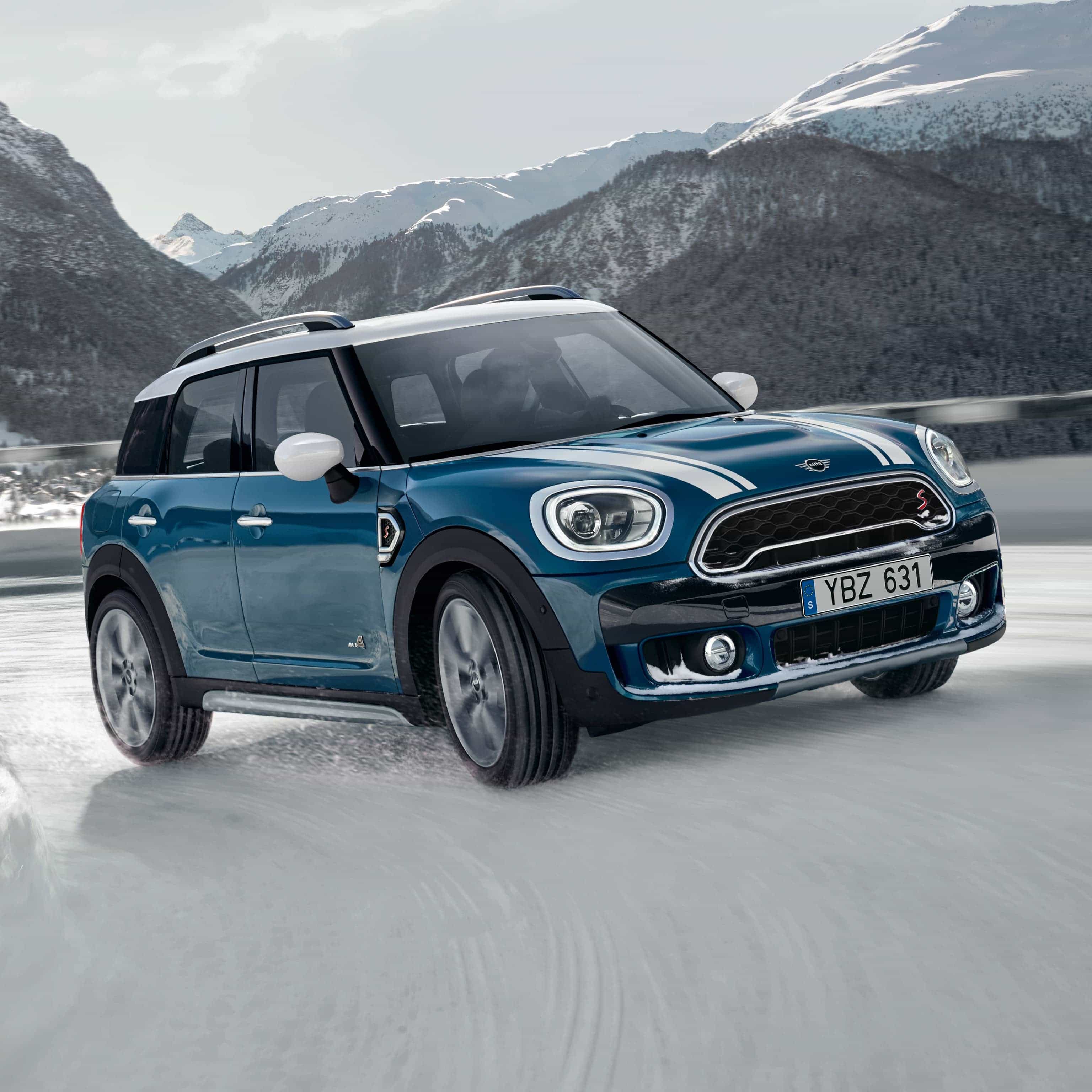 MINI Countryman drives up a mountain road with All4 All-Wheel Drive.