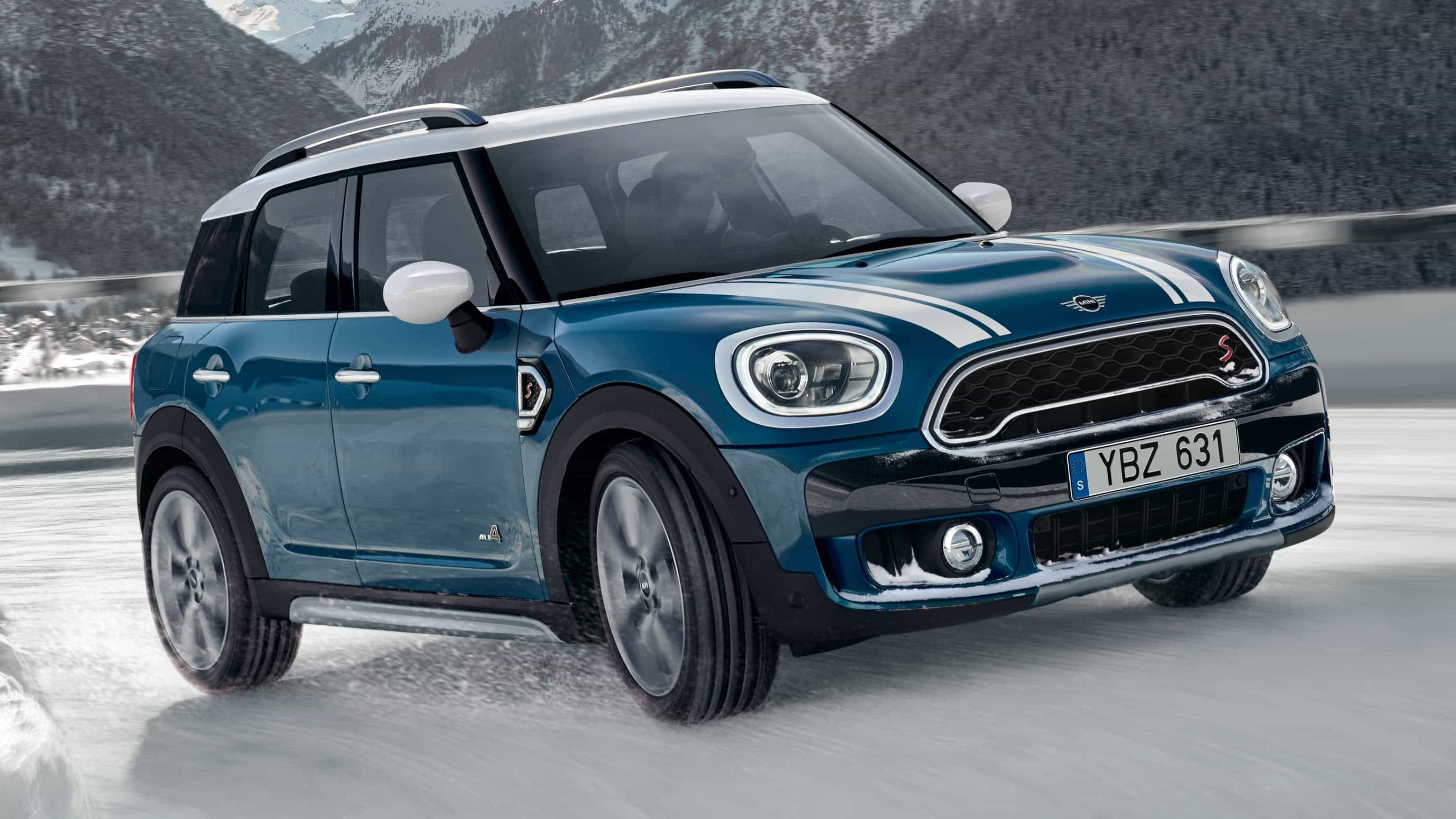 MINI Countryman drives up a mountain road with All4 All-Wheel Drive.