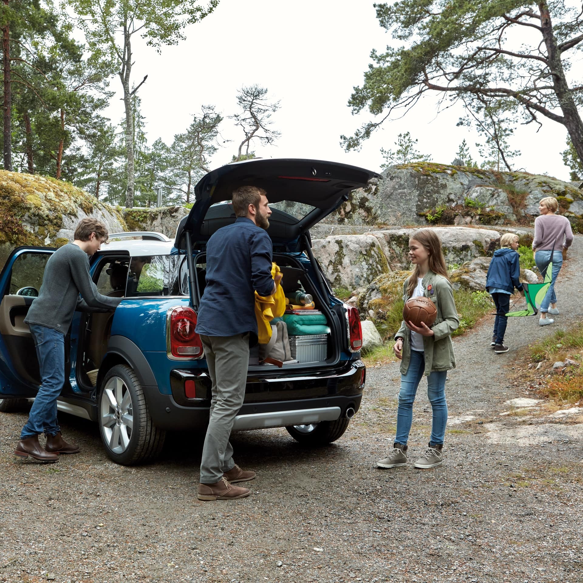 MINI Countryman boot space is getting unpacked by a Family of five.