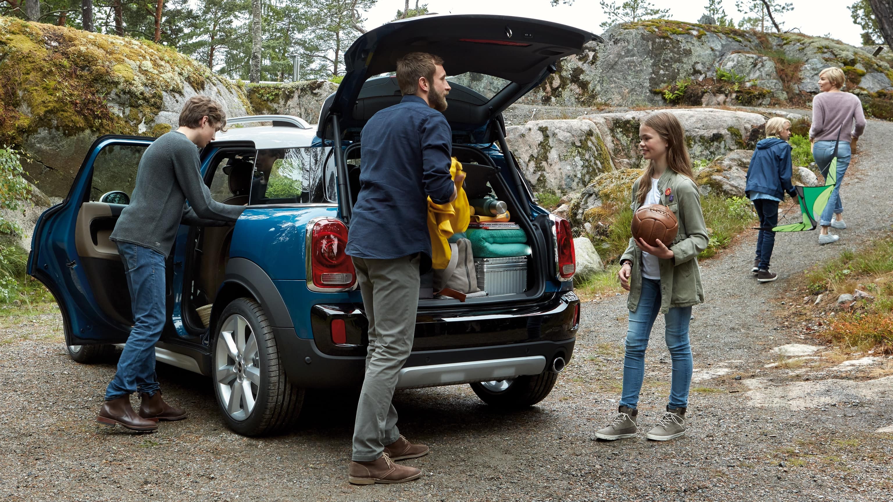 MINI Countryman boot space is getting unpacked by a Family of five.