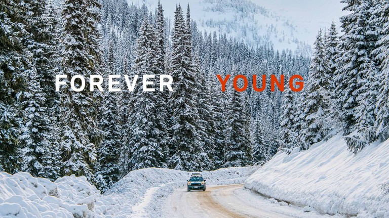 Picture of the MINI Countryman driving through the snowy mountain landscape of British Columbia, Canada. 