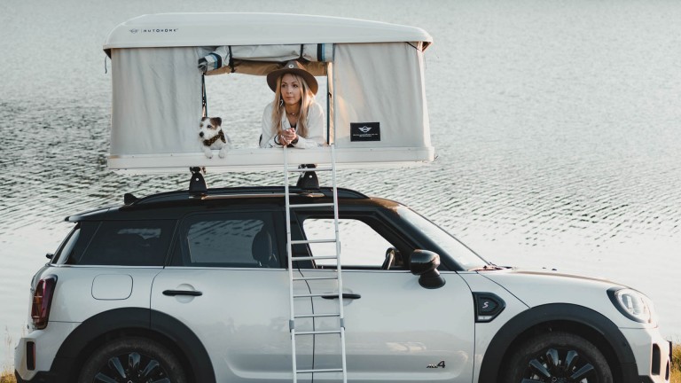 Katarina and Paya looking outside the roof tent.